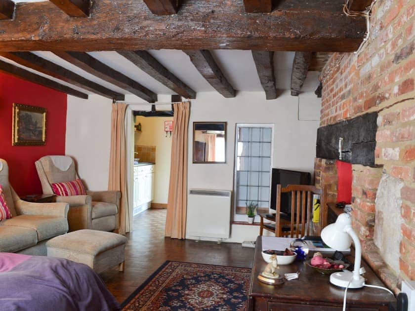 Delightful open plan area with inglenook fireplace | Tudor Cottage Studio - Tudor Cottages, Romsey