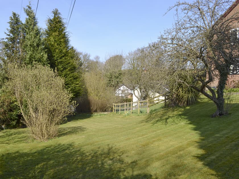 Well-maintained lawned garden area | Swallows Barn Cottage - Colley Mill Farm, North Rode