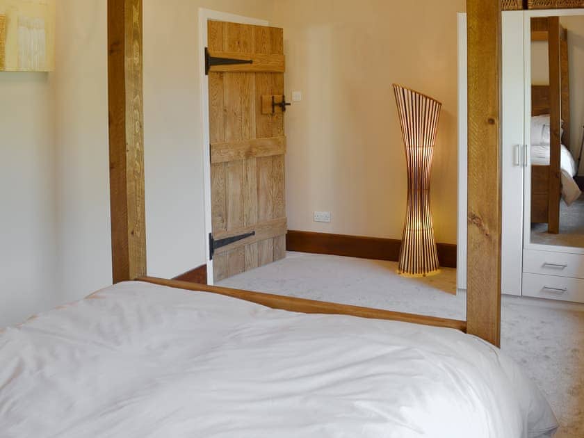 Comfortable four poster bedroom | Little Hoot, Baslow, near Bakewell