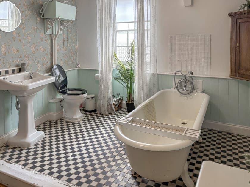 Beautiful period style bathroom -  Cast Iron vintage bath with hand held shower | Nell’s Cottage, Bridlington