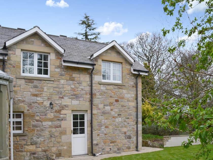 Exterior with enclosed private garden | Holly Cottage, Longhoughton, near Alnwick