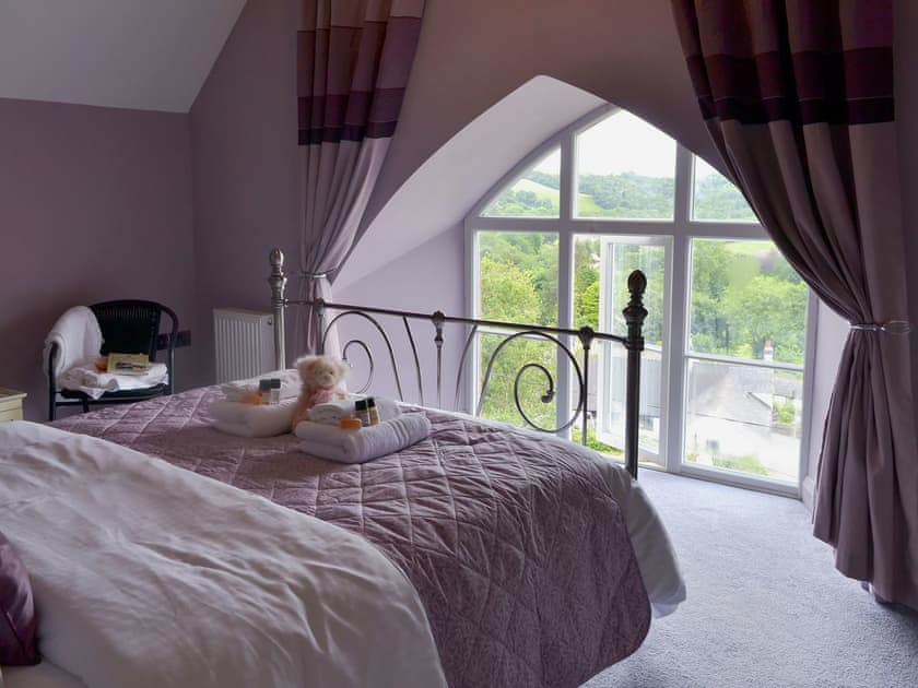Comfortable  bedroom with kingsize bed and en-suite shower room  | The Old Classroom, St Neot, near Liskeard