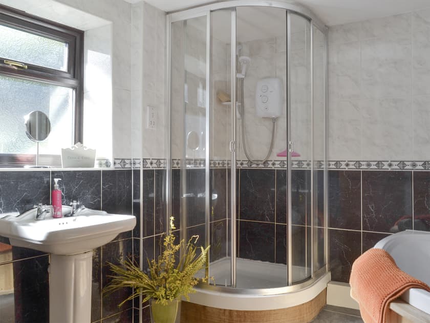 Family bathroom with corner bath and separate walk-in shower cubicle | Poppy Cottage, Bonsall, near Matlock