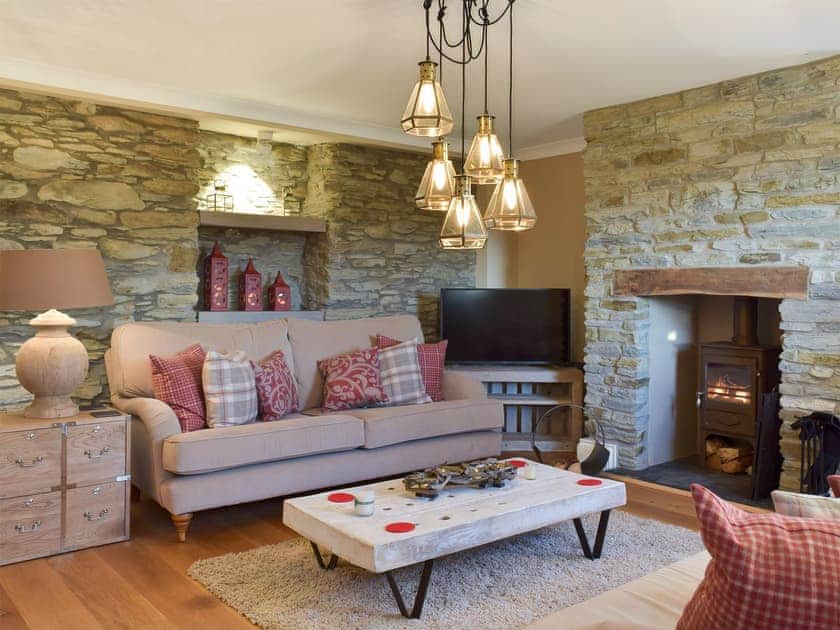 Warming wood burner and feature fireplace in living room | Fountain Hill, Eglwyswrw, near Cardigan