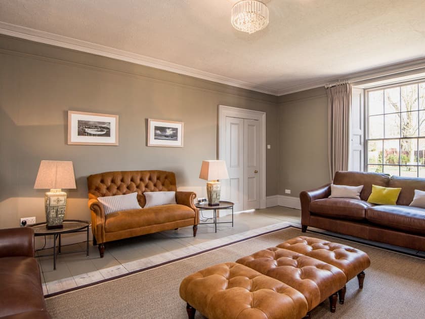 Charming and warm living room with open fire | The Manor House, Syderstone, near Fakenham