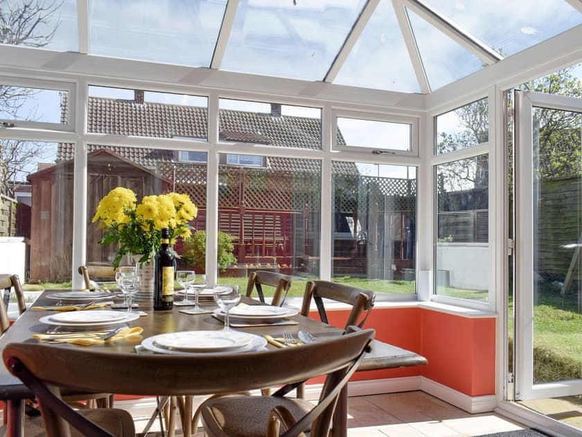 Spacious dining area within conservatory | Valentines On Love Lane, Whitby