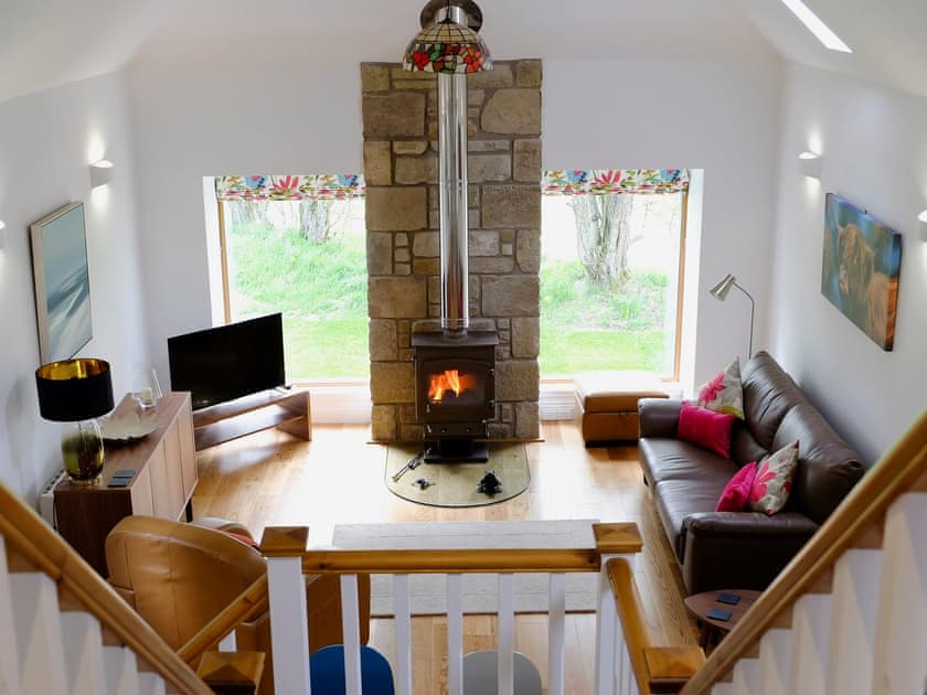 Comfy living area with wood burner | The Barn, Kildary, near Tain