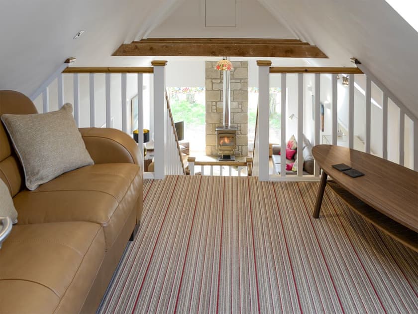 Galleried second living area with sofa bed | The Barn, Kildary, near Tain