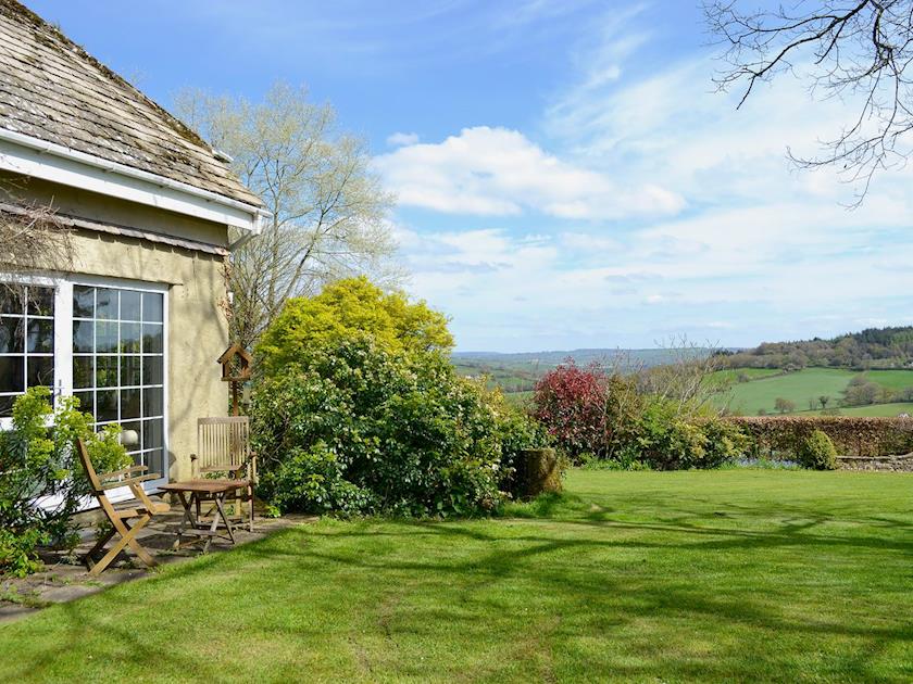 Shared enclosed small lawned garden with patio and furniture | Burrow Farm Garden Retreat - Valley View - Burrow Farm Gardens Retreat, Dalwood, near Axminster