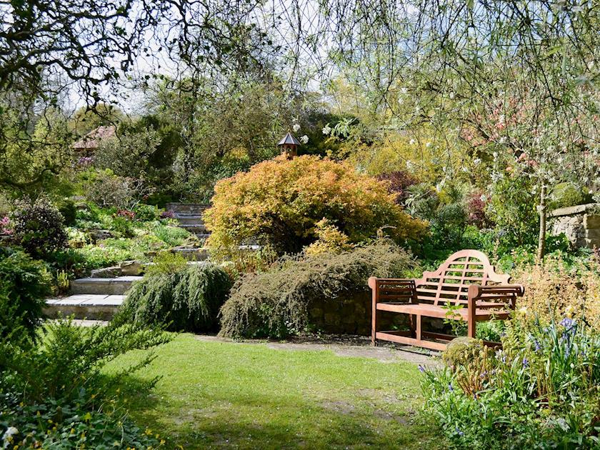 Shared enclosed small lawned garden with patio and furniture | Burrow Farm Garden Retreat - Valley View - Burrow Farm Gardens Retreat, Dalwood, near Axminster