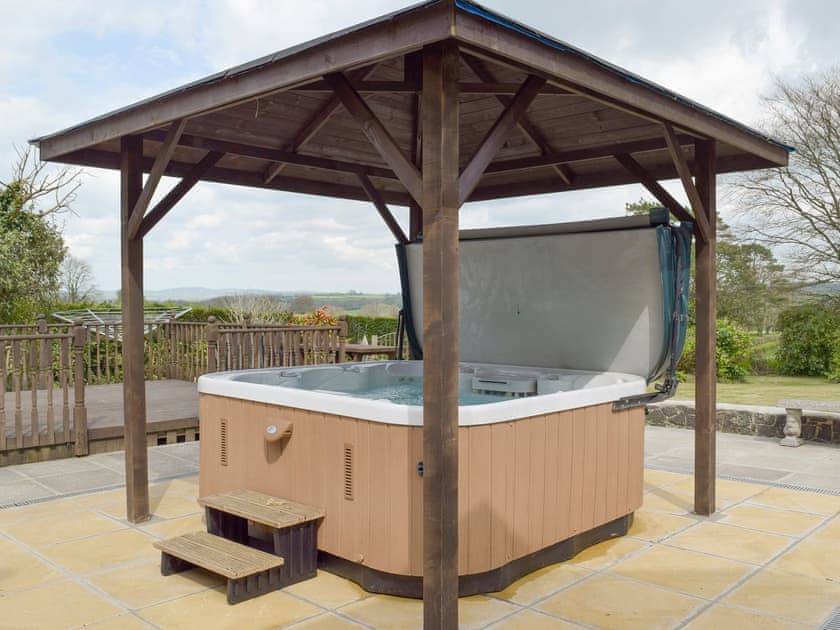 Shaded hot-tub on paved patio | Green Haven, Narberth
