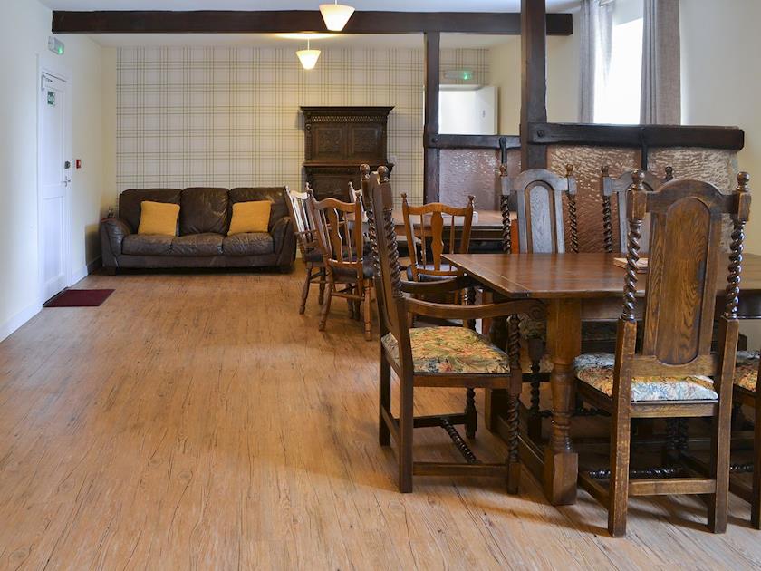 Wood-floored dining room | Blaithwaite Stables - Blaithwaite Estate, Waverton, near Wigton