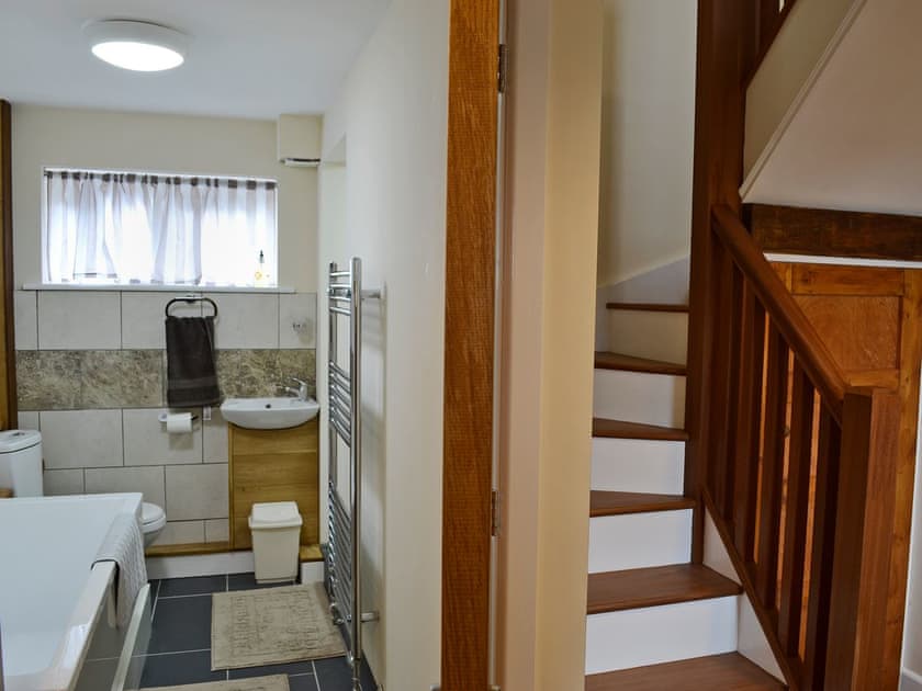 Bathroom with bath and shower cubicle | Oak House - Cysgod Y Coed Cottages, Llanrhaeadr, near Denbigh