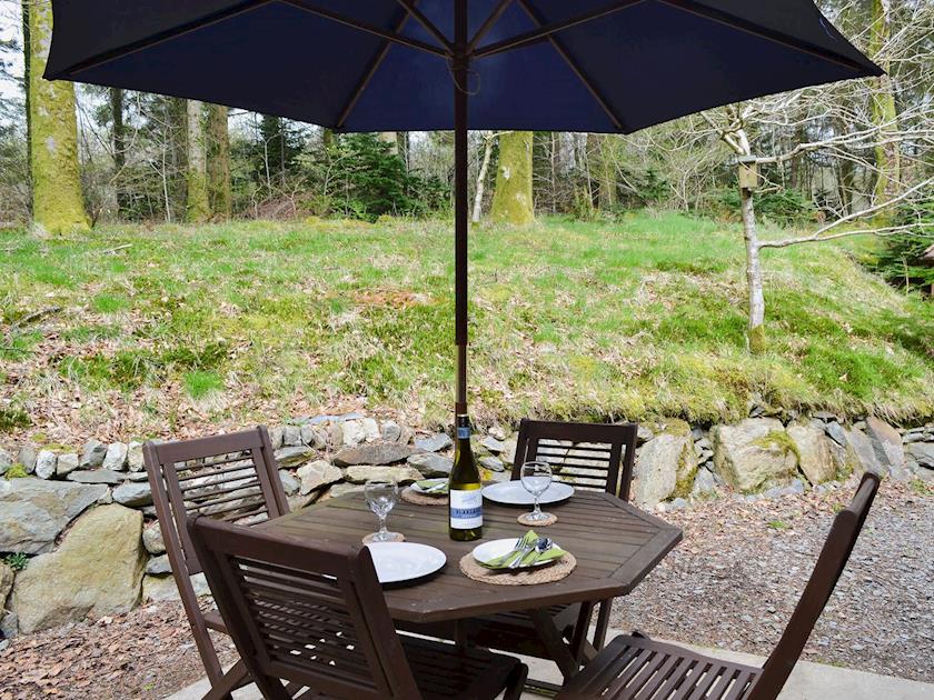 Sitting-out-area with funiture and woodland views | Glan-y-Gors, Beddgelert