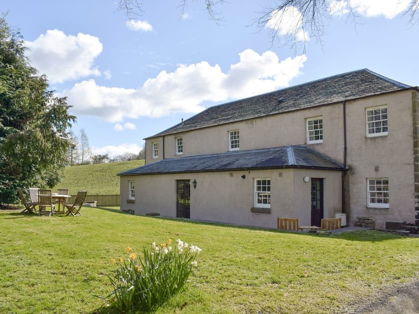 Rear of property with sitting out area in garden | The Stables, Pitcairlie, near St Andrews