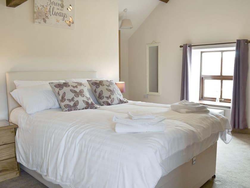 Sumptuous second double bedroom | Llofft Storws - Bronallt Barns, Llanynghenedl, near Holyhead