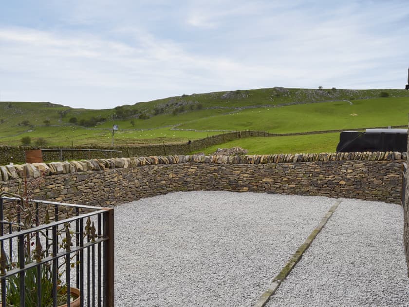 Courtyard with patio and garden furniture | Booth Farm Cottage - Booth Farm, Buxton