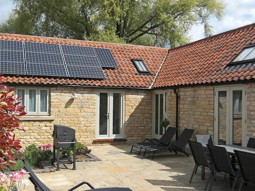 Secluded, enclosed courtyard with patio | The Stables, Aisby, near Grantham