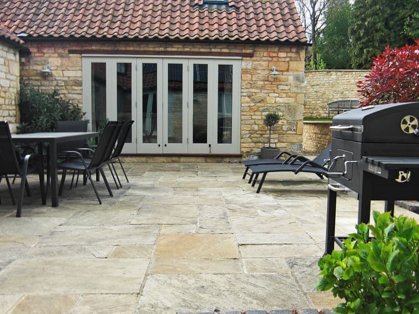 Secluded, enclosed courtyard with patio | The Stables, Aisby, near Grantham