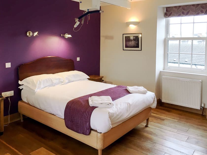 Accessible bedroom featuring x-y ceiling track hoists  | The Moat House, Annan