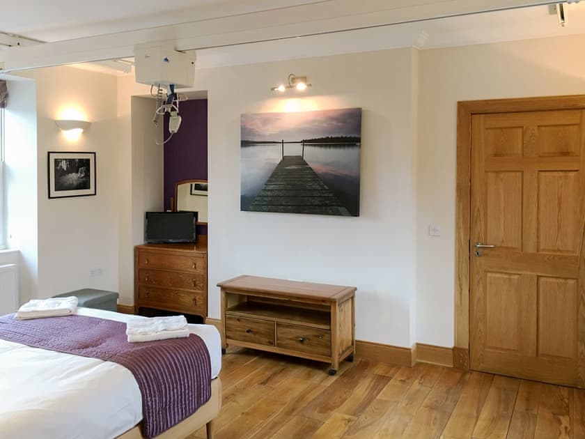 Accessible bedroom featuring x-y ceiling track hoists  | The Moat House, Annan