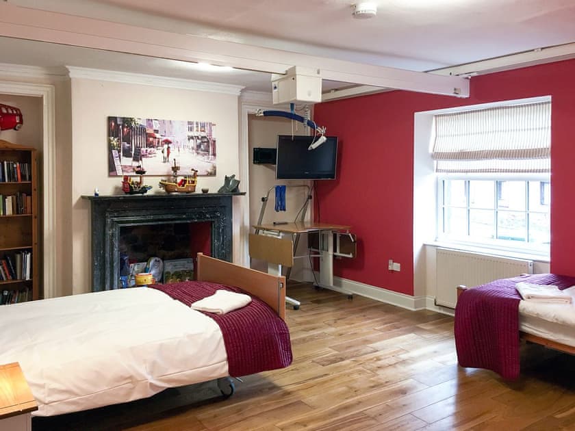 Accessible bedroom featuring x-y ceiling track hoists  | The Moat House, Annan