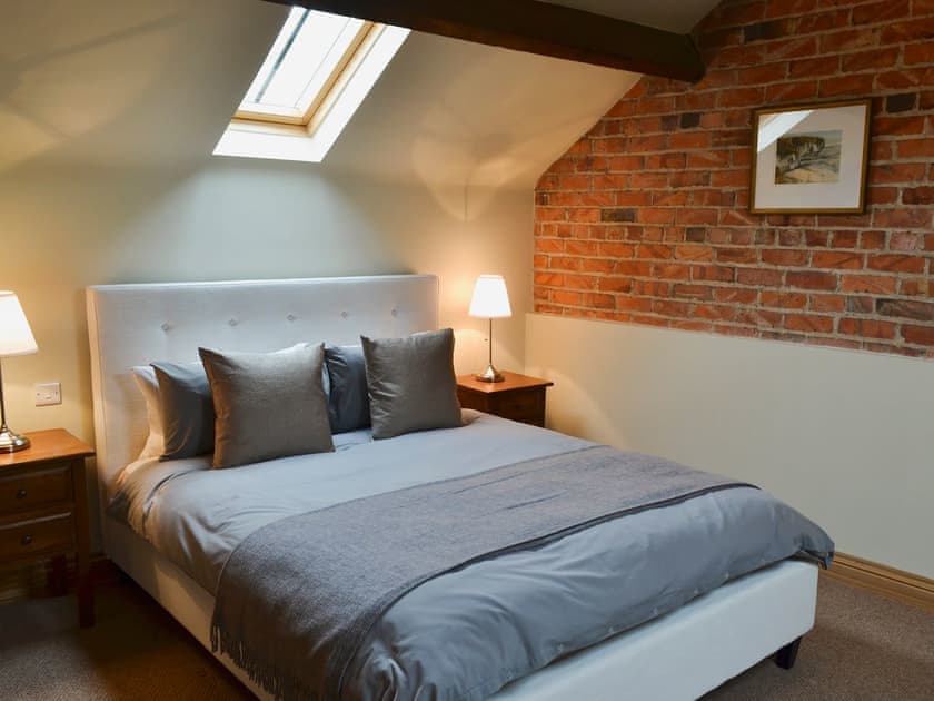 Double bedroom with original exposed brickwork | Mullins Cottage - Lebberston Carr Farm, Lebberston, near Filey