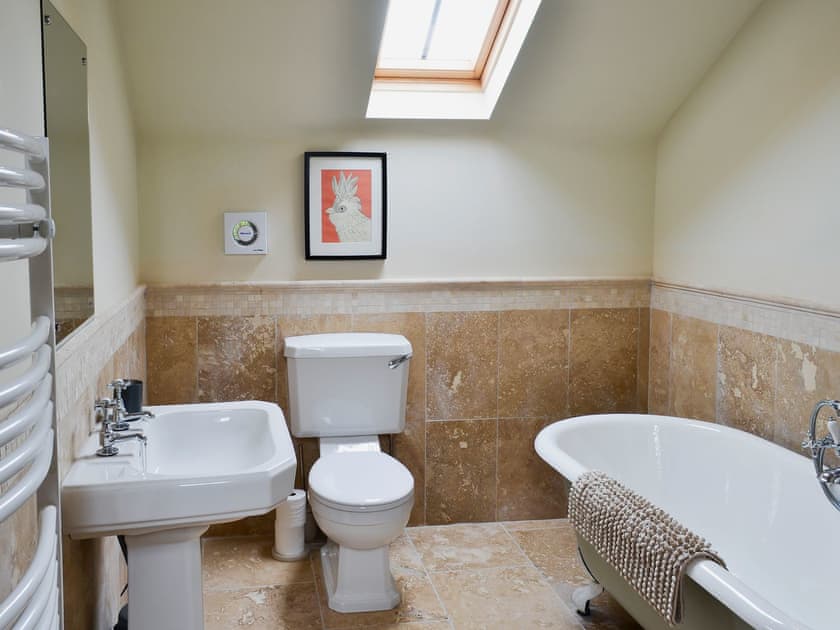Spacious bathroom with roll top bath and shower over bath | Mullins Cottage - Lebberston Carr Farm, Lebberston, near Filey