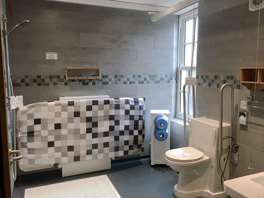 Wet room with x-y ceiling track hoists  | The Moat House, Annan