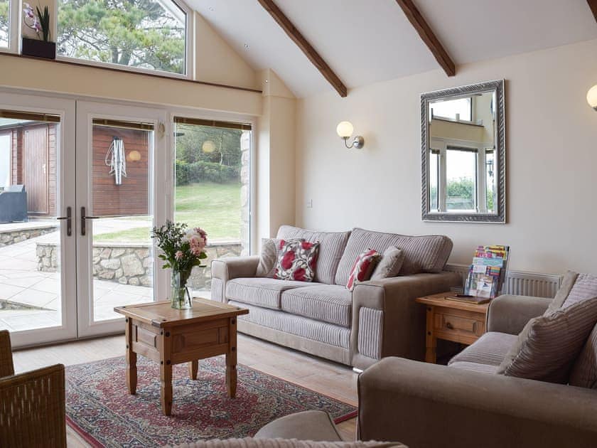 Nicely furnished cosy living room with stunning views | Brynymor Cottage, Llangennith, near Swansea