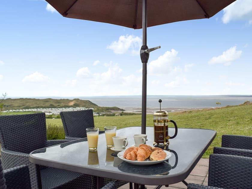 Dining out area with stunning views | Brynymor Cottage, Llangennith, near Swansea