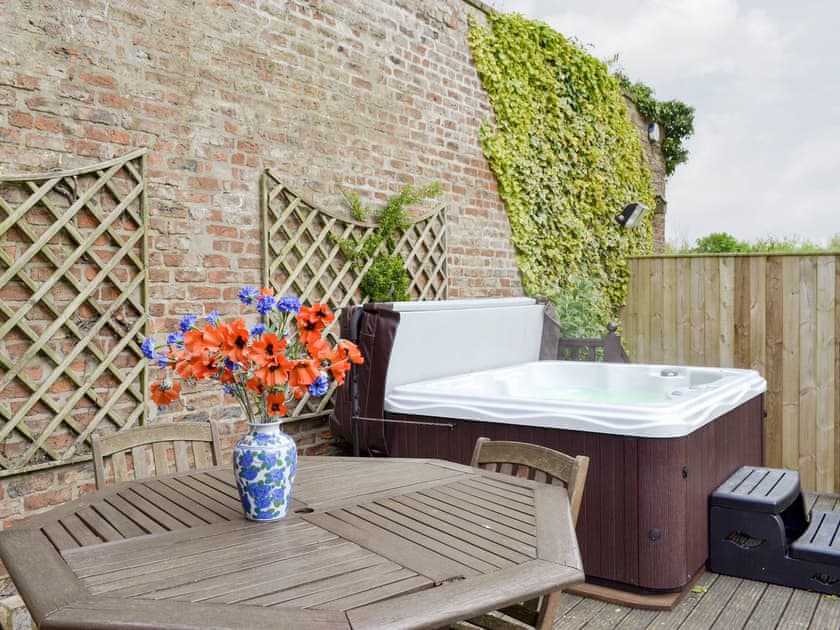 Decked patio with outdoor furniture and hot tub | Walled Garden Lodge, Camerton, near Hull