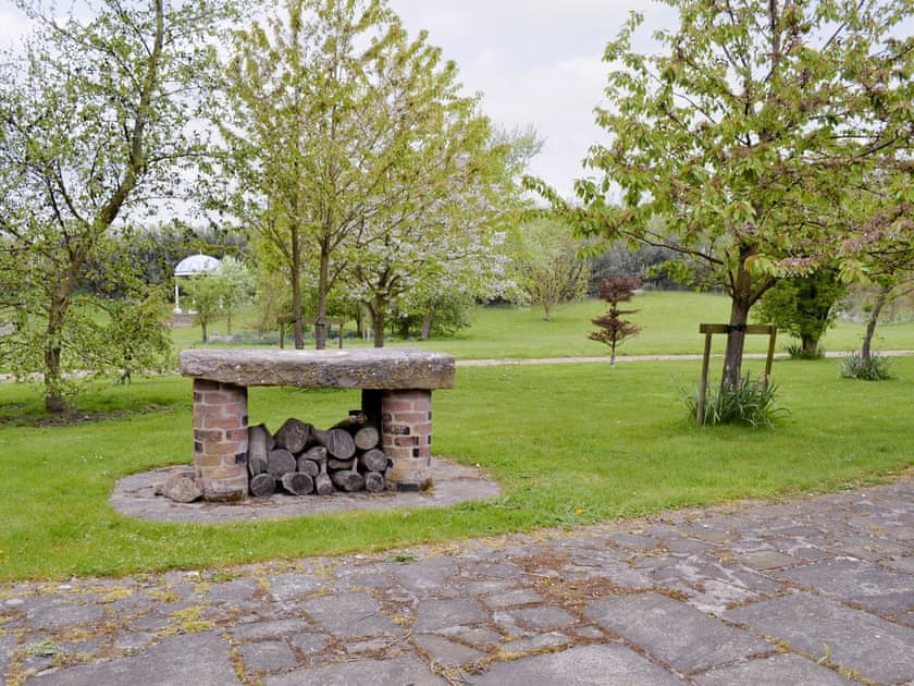 Well-maintained lawned gardens to front of property | Walled Garden Lodge, Camerton, near Hull