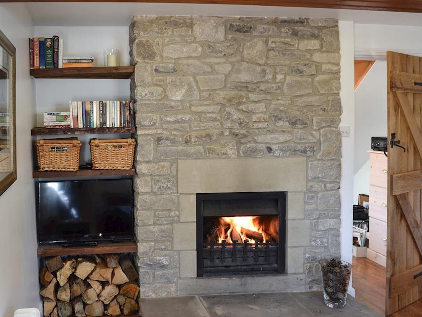 Living room with open fire | Barn on the Green, Foolow, near Tideswell