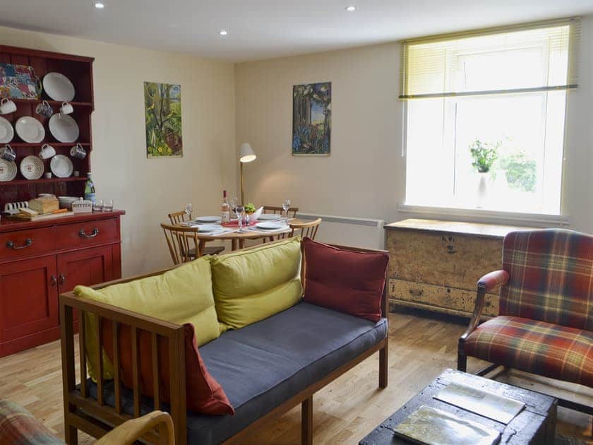 Relaxing living and dining room with multi-fuel burner | Brier Dene End Cottage - Brier Dene Farm Cottages, Old Hartley, near Whitley Bay 