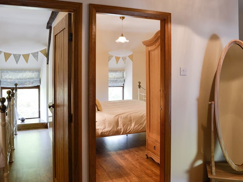 Hallway leading to bedrooms | Maybill Cottage, Cwm Penmachno, near Betws-y-Coed