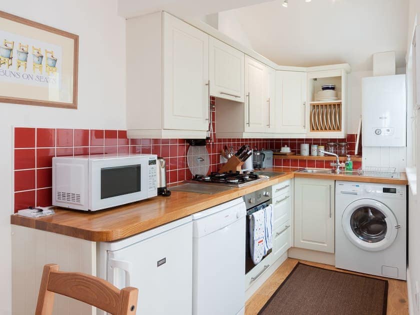 Fully equipped kitchen area | Kitcat Cottage, Dartmouth