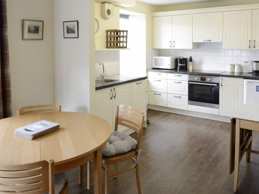Spacious dining area and well-equipped fitted kitchen | Birch Cottage - Glenrossal Cottages, Rosehall, near Lairg