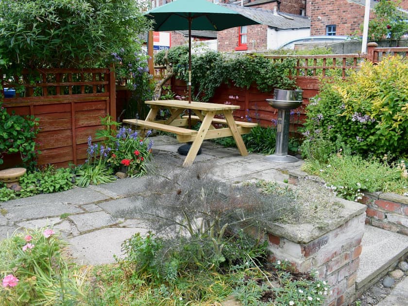 Enclosed garden with sitting-out area, garden furniture and BBQ | Hope Cottage, Whitby