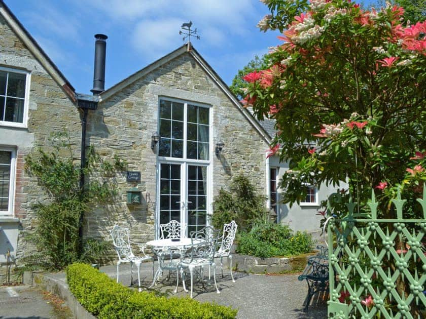 This light and airy cottage has French doors leading to a sunny courtyard | Stable Cottage - Peregrine Hall Cottages, Lostwithiel