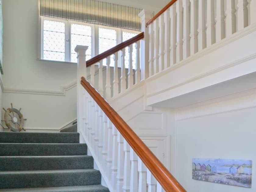 Grand staircase with leaded glass windows | Three The Boulevard, Sheringham