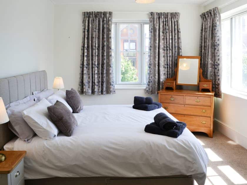 Romantic and inviting double bedroom with super kingsize bed | Three The Boulevard, Sheringham