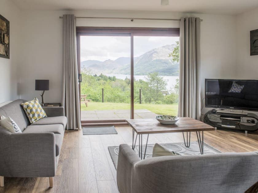 Welcoming living room with amazing view through the patio door | Rosdail, Inverinate, near Kyle