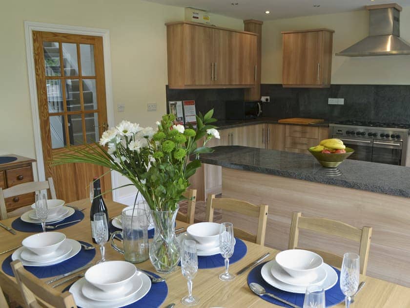 Spacious kitchen/dining room with French doors to patio | Elm Croft, Falstone, near Bellingham
