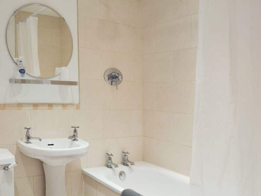 Bathroom with shower over bath and heated towel rail | Pear Tree House Annexe, Wooldale, near Holmfirth