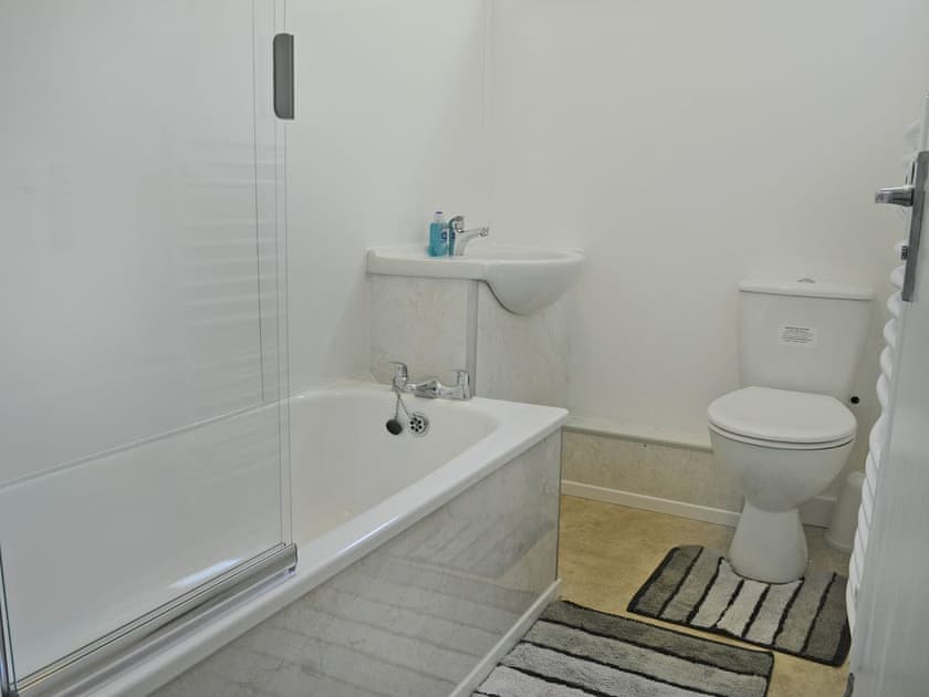 Bathroom with shower over bath  | Hives - At Berridon Lodges, Bradworthy, near Holsworthy