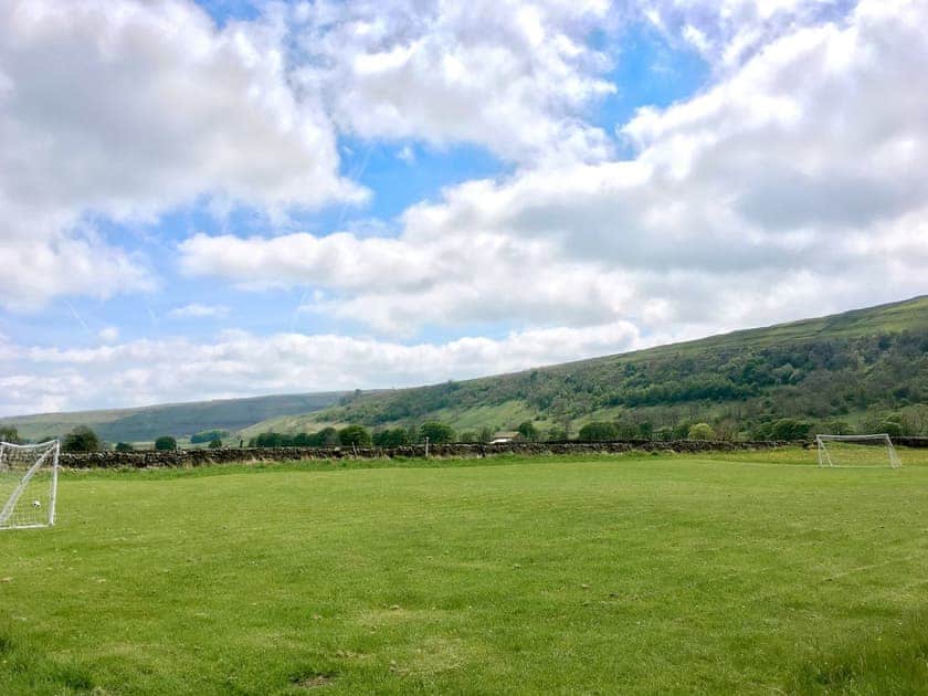 Large children’s playing field with goal posts | Stonelands Farmyard Cottages, Litton near Kettlewell