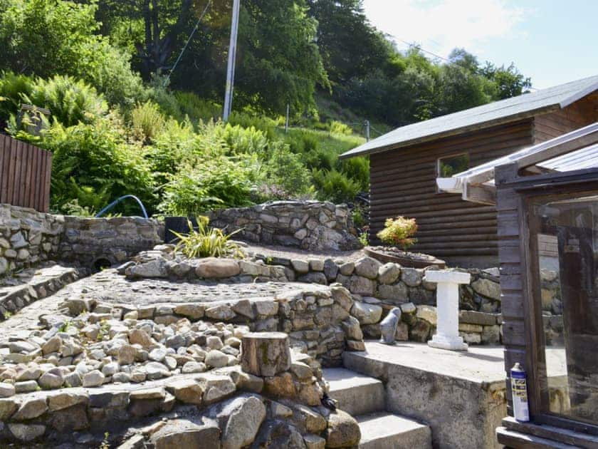 Terraced garden with sitting-out area and garden furniture | Woodend, Fort William