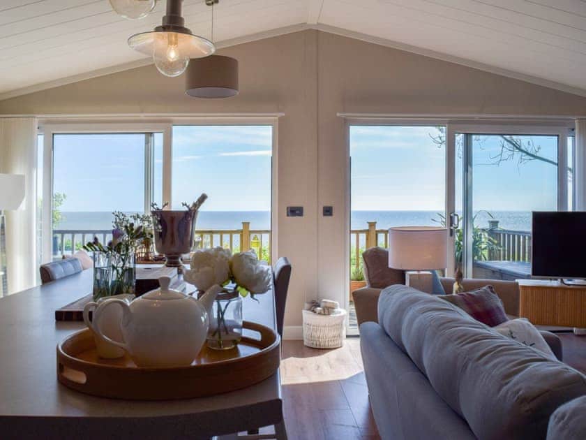 Delightful luxurious open plan living space with sliding doors to verandah | SeaTrees, Corton, near Lowestoft