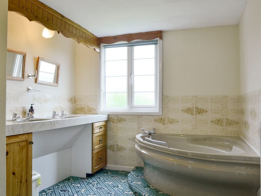 Bathroom with corner bath | The Coach House, Craven Arms